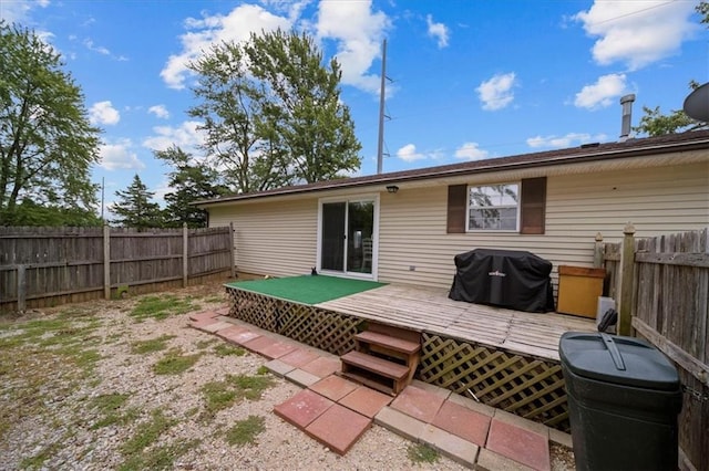 back of house featuring a fenced backyard and a wooden deck