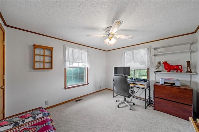 home office with carpet flooring, a textured ceiling, and ornamental molding