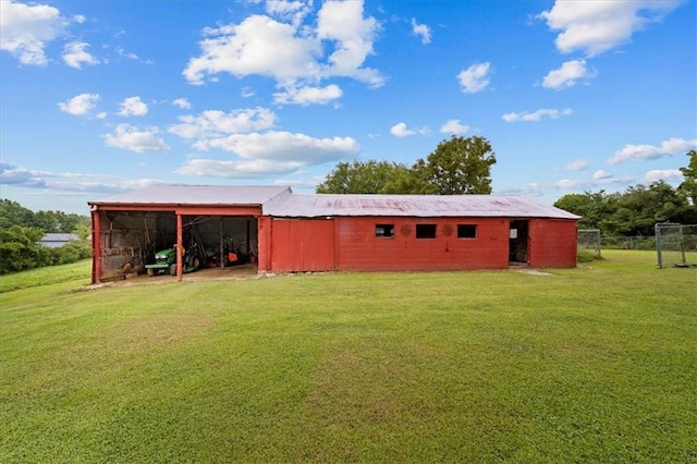 view of pole building with a lawn