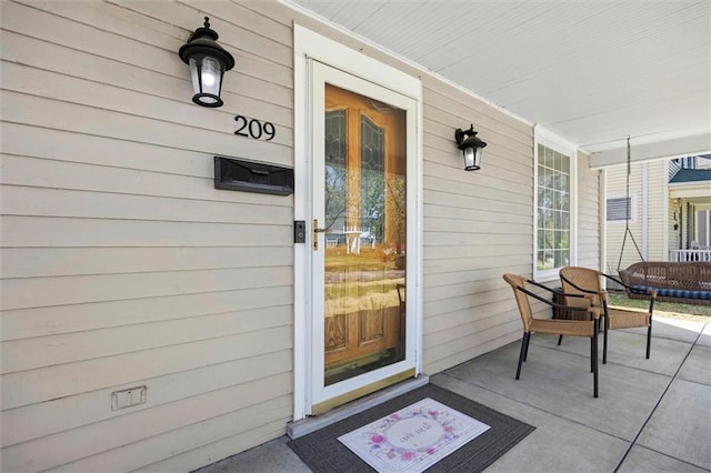 entrance to property with a porch