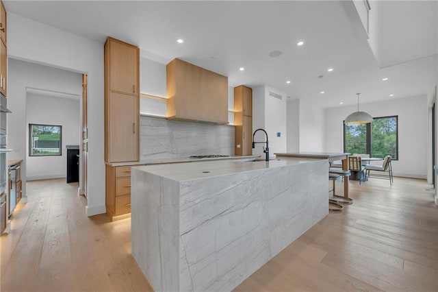 kitchen featuring recessed lighting, modern cabinets, and light wood-style floors