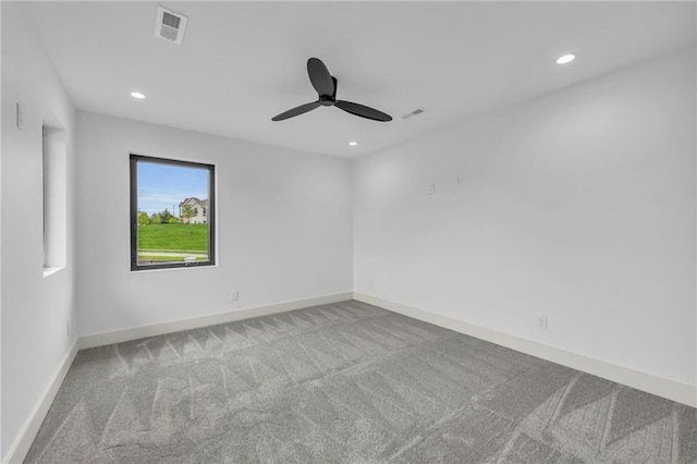 carpeted spare room with baseboards, visible vents, a ceiling fan, and recessed lighting