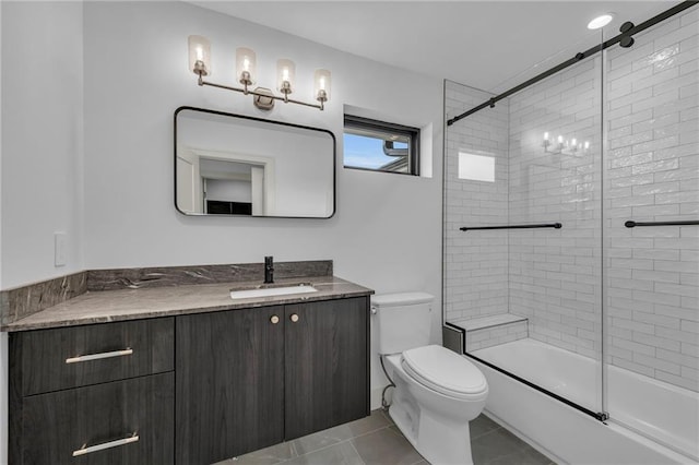 bathroom featuring tile patterned floors, bath / shower combo with glass door, toilet, and vanity