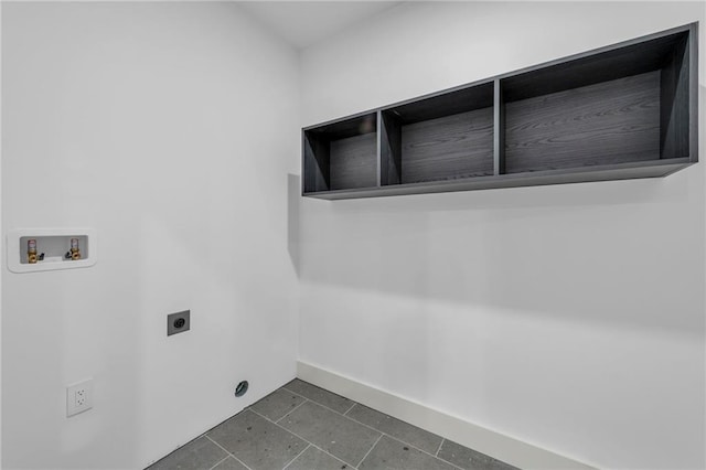 clothes washing area featuring hookup for a washing machine, laundry area, electric dryer hookup, dark tile patterned floors, and baseboards