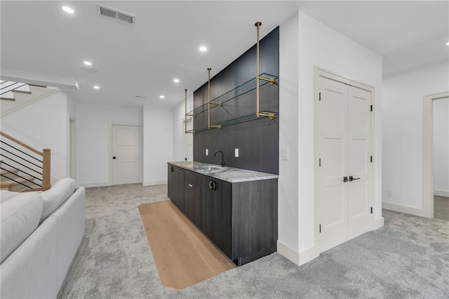 bar featuring visible vents, recessed lighting, stairs, and light carpet