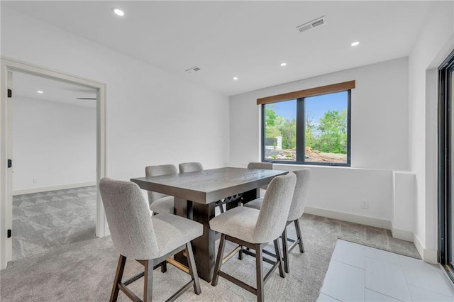 dining space featuring light colored carpet, visible vents, recessed lighting, and baseboards