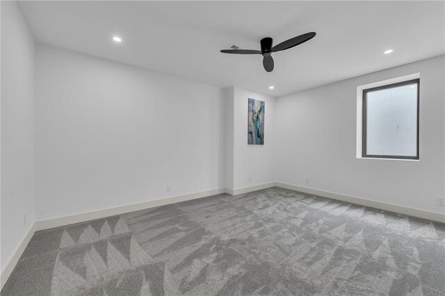 empty room with a ceiling fan, carpet flooring, recessed lighting, and baseboards