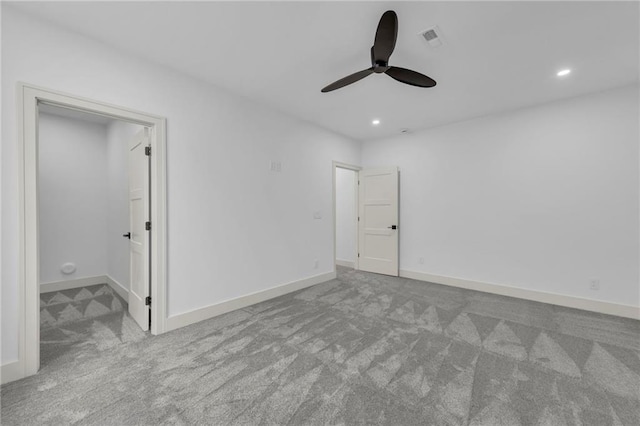 unfurnished bedroom featuring visible vents, recessed lighting, baseboards, and carpet floors