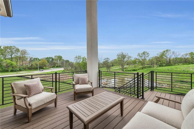 wooden deck with an outdoor living space