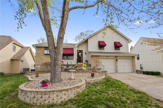4012 NE Brooktree Ln, Kansas City, MO 64119 - view of front facade featuring a garage, a front yard, stone siding, and concrete driveway
