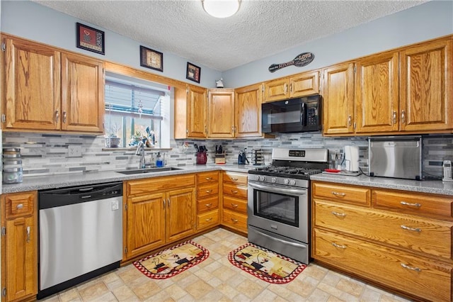 4012 NE Brooktree Ln, Kansas City, MO 64119 - kitchen with light countertops, appliances with stainless steel finishes, a sink, and backsplash