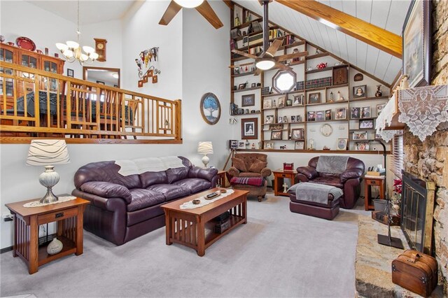 4012 NE Brooktree Ln, Kansas City, MO 64119 - living room featuring carpet floors, a stone fireplace, high vaulted ceiling, and ceiling fan with notable chandelier