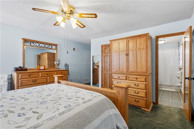 4012 NE Brooktree Ln, Kansas City, MO 64119 - bedroom with dark carpet, visible vents, ceiling fan, and a textured ceiling