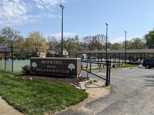 4012 NE Brooktree Ln, Kansas City, MO 64119 - community sign featuring uncovered parking and fence