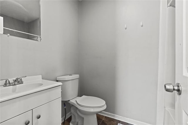2701 Wilson Ave, Leavenworth, KS 66048 - full bathroom featuring vanity, toilet, baseboards, tile patterned flooring, and a shower