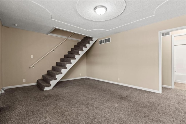 2701 Wilson Ave, Leavenworth, KS 66048 - finished below grade area with stairs, carpet, a textured ceiling, and baseboards