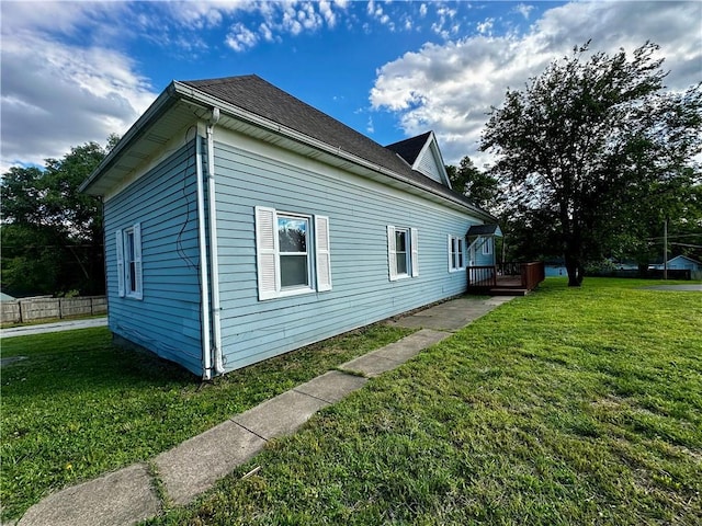 2701 Wilson Ave, Leavenworth, KS 66048 - view of property exterior featuring a lawn and a wooden deck