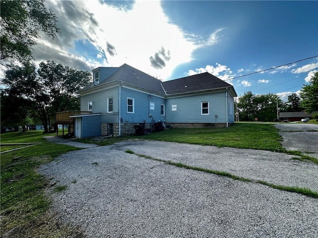 2701 Wilson Ave, Leavenworth, KS 66048 - view of side of property with a yard and gravel driveway