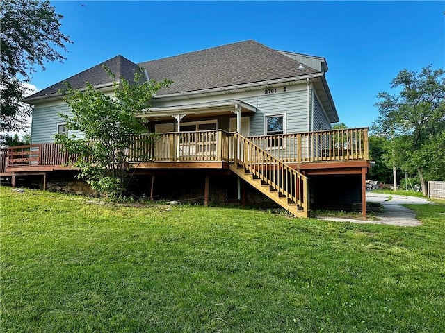 2701 Wilson Ave, Leavenworth, KS 66048 - back of property with a deck, stairway, a yard, and a shingled roof