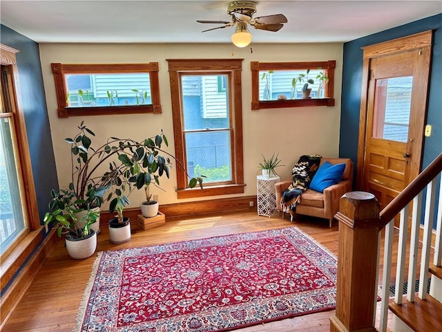3640 Forest Ave, Kansas City, MO 64109 - sitting room with plenty of natural light and wood finished floors
