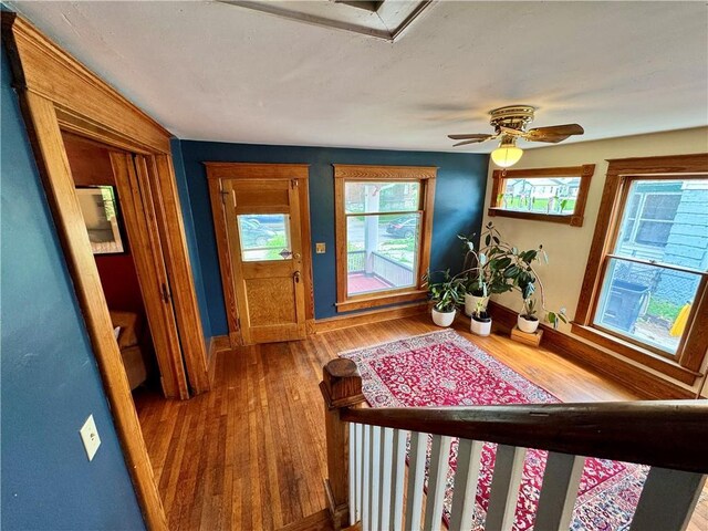 3640 Forest Ave, Kansas City, MO 64109 - entrance foyer with wood finished floors, baseboards, and a ceiling fan