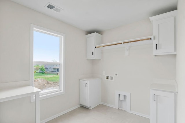16470 W 166th Pl, Olathe, KS 66062 - washroom with hookup for an electric dryer, hookup for a washing machine, baseboards, and cabinet space