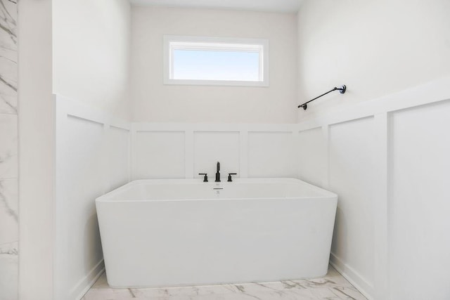 16470 W 166th Pl, Olathe, KS 66062 - full bathroom with a decorative wall, a freestanding bath, marble finish flooring, and wainscoting