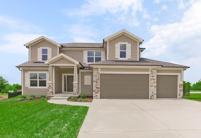 16470 W 166th Pl, Olathe, KS 66062 - view of front of home with concrete driveway, a front yard, an attached garage, and roof with shingles