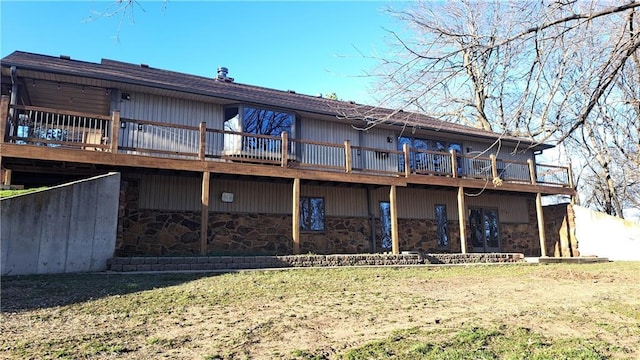 2101A Dove Rd, Longton, KS 67352 - back of house with stone siding, a deck, and a yard