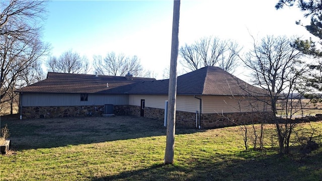 2101A Dove Rd, Longton, KS 67352 - view of side of property with stone siding and a yard