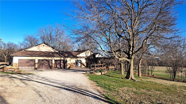 2101A Dove Rd, Longton, KS 67352 - ranch-style house with dirt driveway, a garage, and a front lawn