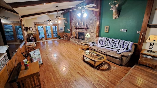 2101A Dove Rd, Longton, KS 67352 - living area with french doors, hardwood / wood-style floors, beam ceiling, and ceiling fan
