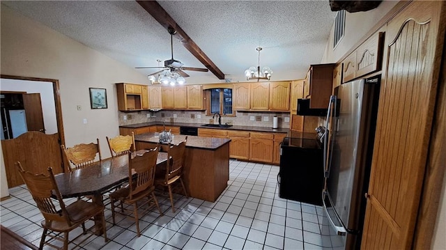 2101A Dove Rd, Longton, KS 67352 - kitchen with light tile patterned floors, a sink, dark countertops, and black appliances