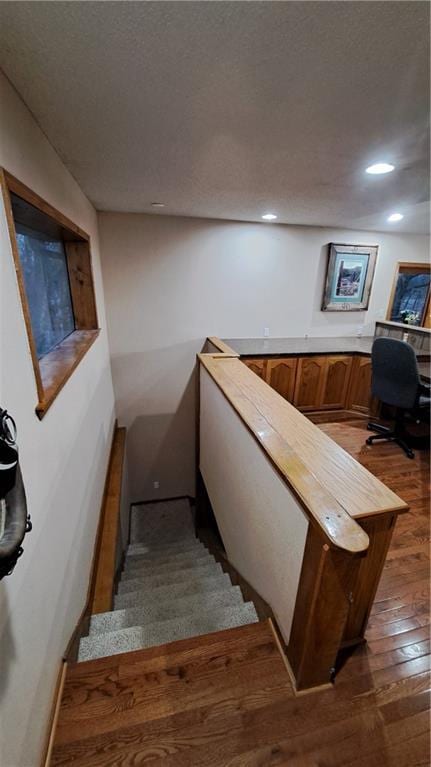 2101A Dove Rd, Longton, KS 67352 - stairs featuring a textured ceiling, recessed lighting, and wood-type flooring
