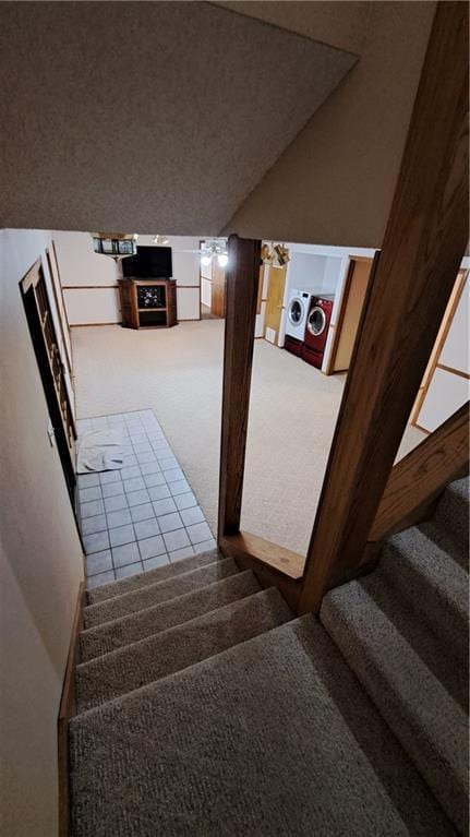 2101A Dove Rd, Longton, KS 67352 - staircase with independent washer and dryer, vaulted ceiling, and carpet