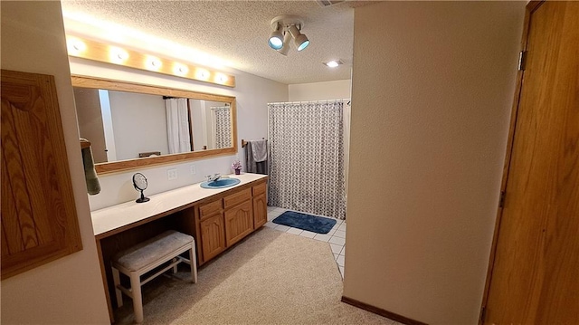 2101A Dove Rd, Longton, KS 67352 - full bathroom with tile patterned flooring, vanity, curtained shower, and a textured ceiling