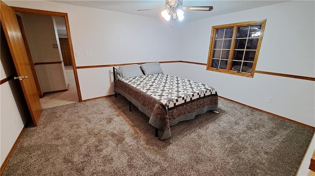 2101A Dove Rd, Longton, KS 67352 - bedroom featuring baseboards, carpet floors, a textured ceiling, and a ceiling fan