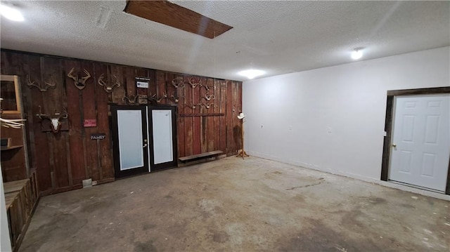 2101A Dove Rd, Longton, KS 67352 - finished basement with wooden walls and a textured ceiling