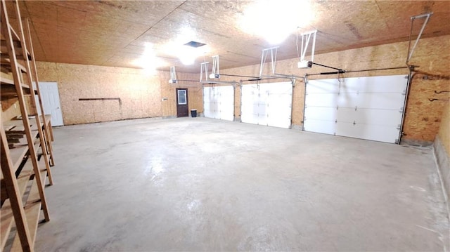 2101A Dove Rd, Longton, KS 67352 - garage featuring a garage door opener