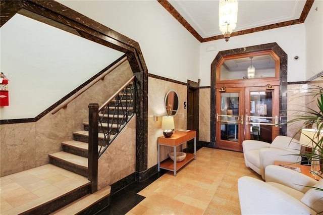 912 Baltimore Ave Unit 802, Kansas City, MO 64105 - stairway with tile walls, ornamental molding, arched walkways, and wainscoting
