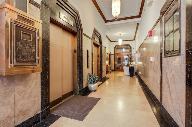 912 Baltimore Ave Unit 802, Kansas City, MO 64105 - hall featuring elevator, crown molding, a high ceiling, and arched walkways