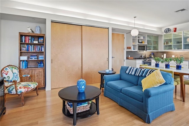 912 Baltimore Ave Unit 802, Kansas City, MO 64105 - living room with light wood-type flooring