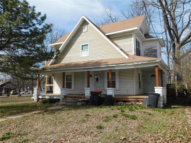 308 W 5th St, Pittsburg, KS 66762 - country-style home with covered porch and roof with shingles
