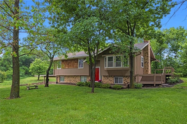 14404 Kansas Ave, Bonner Springs, KS 66012 - bi-level home featuring a chimney, brick siding, and a front yard