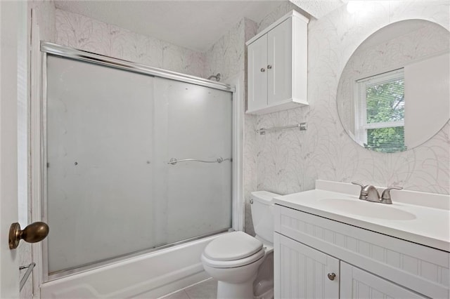14404 Kansas Ave, Bonner Springs, KS 66012 - full bath with wallpapered walls, vanity, and enclosed tub / shower combo