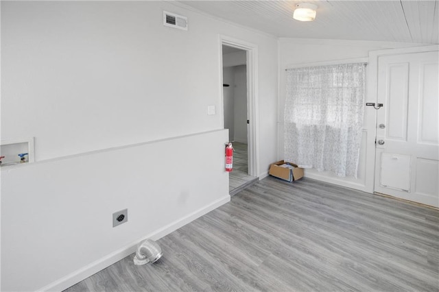clothes washing area with washer hookup, wood finished floors, electric dryer hookup, laundry area, and visible vents
