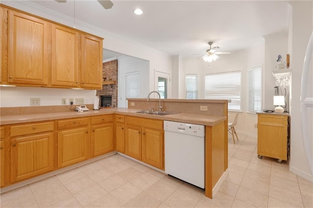 kitchen featuring a ceiling fan, a sink, light tile patterned floors, dishwasher, and a peninsula
