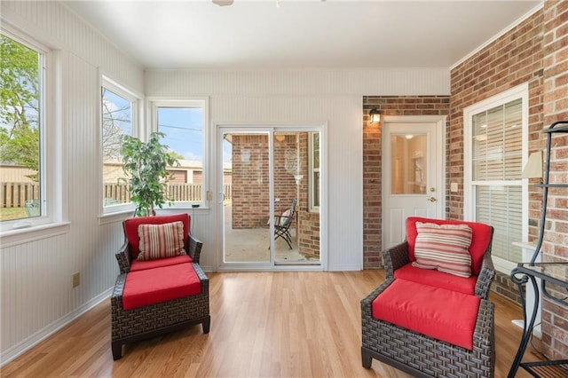 sunroom featuring wood finished floors