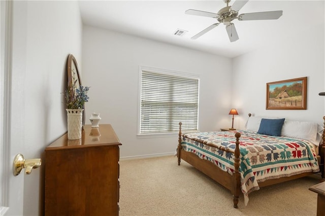 bedroom with ceiling fan, visible vents, baseboards, and light carpet