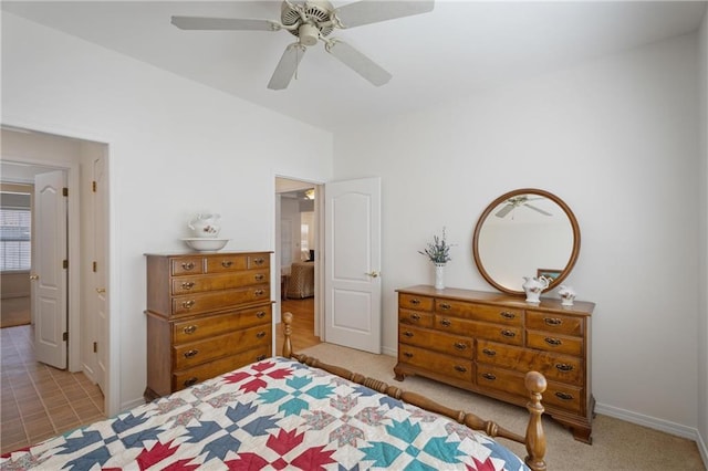 carpeted bedroom featuring a ceiling fan and baseboards
